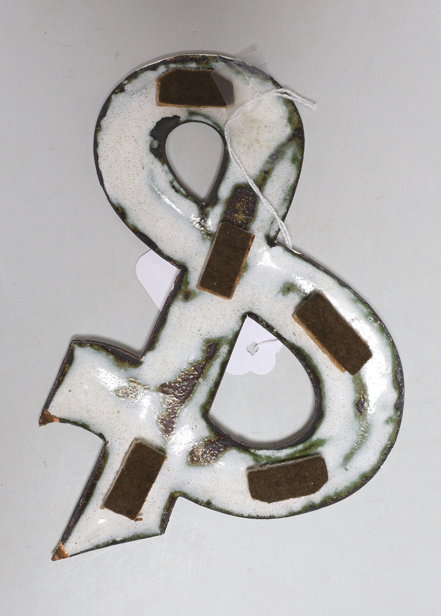A white enamelled ‘&’ sign,15.5cms high